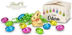 Buntes Lindt Osternest - Lindt-Osterhase mit 10 Eiern, auch in individueller Pralinenschachtel als Werbeartikel